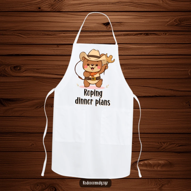 Funny cowboy bear in a cowboy hat, lassoing a tumbleweed, on a functional apron, bringing humor to the kitchen.