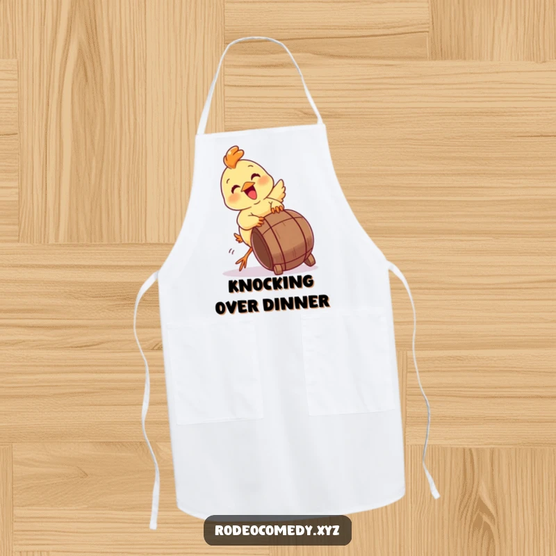 Funny baby chick apron, gleefully attempting to tip a miniature barrel. A humorous addition to kitchen wear.