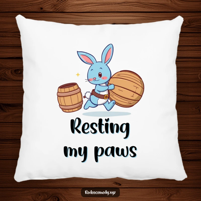 Funny blue bunny wearing spurs, chasing a rolling barrel, printed on a soft pillow for humorous comfort and playful vibes.