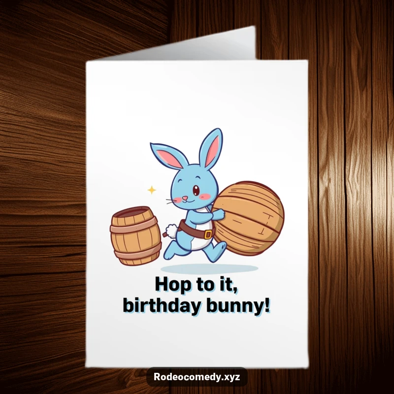 Funny Free Printable Birthday Card: Blue bunny in spurs playfully chasing a rolling barrel, capturing energetic fun.