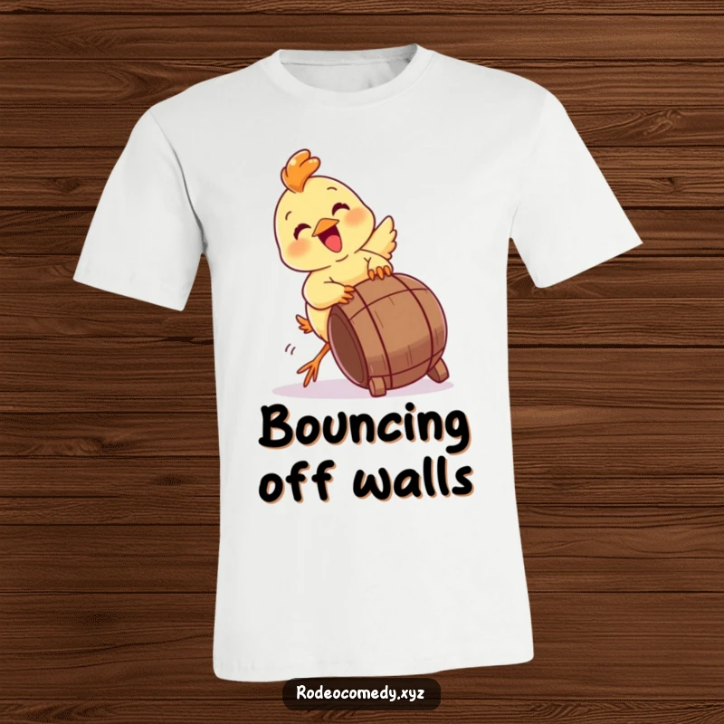 Funny baby chick T-shirt, enthusiastically trying to tip a small barrel. A depiction of pure, playful mischief.